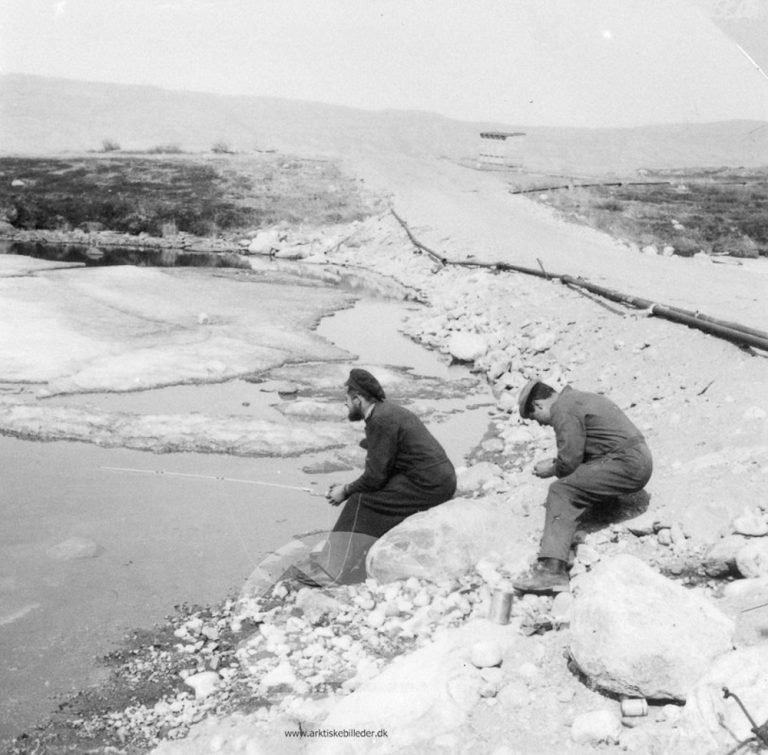 Two men, one with a fishing rod, from the collection of the Danish Arctic Institute