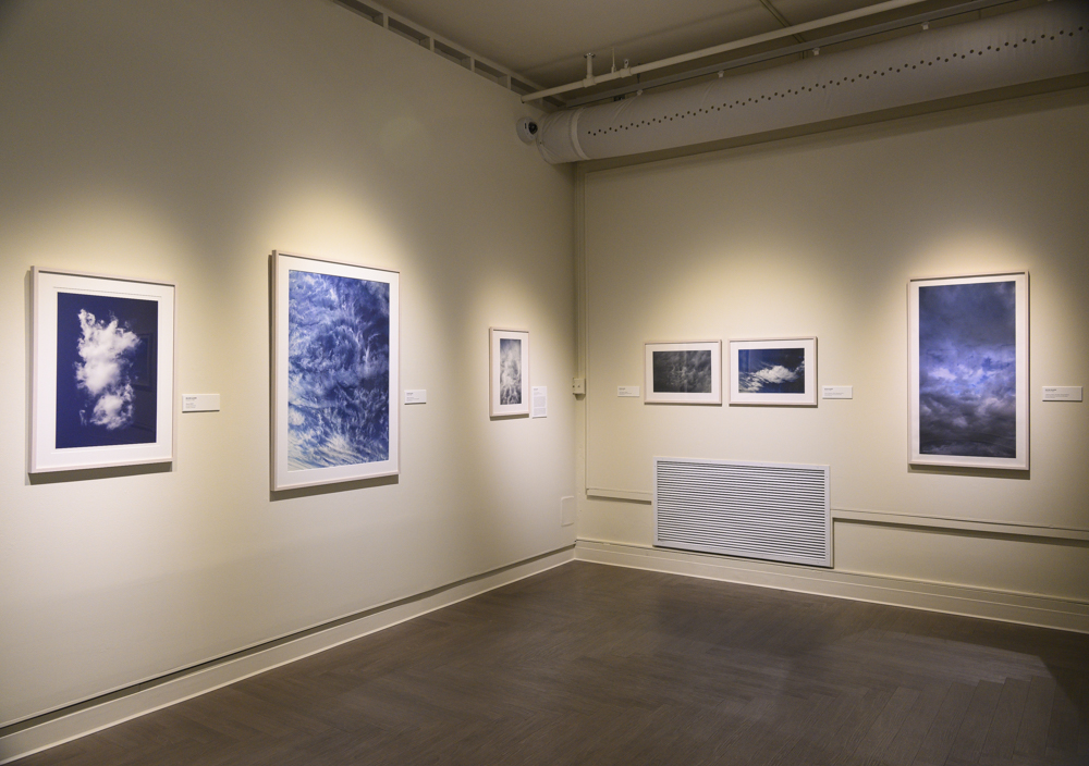 Installation of cloud photographs at the Benton Museum of Art