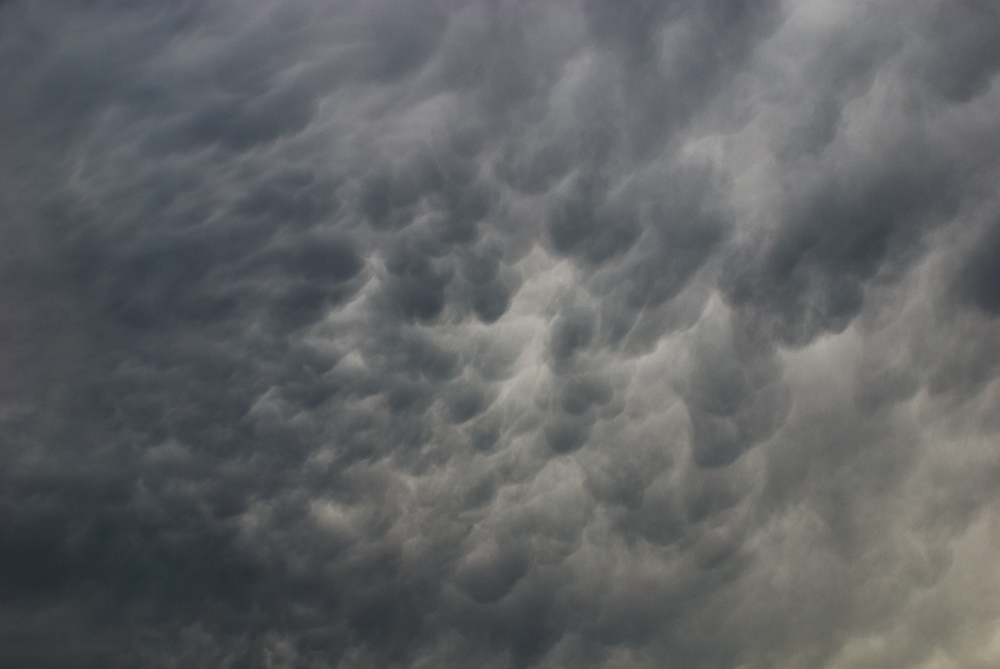 Ready to Rain (2009), archival pigment print, hand-colored with pastel pencils, 12 x 18 inches